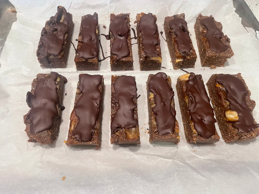 tray of peanut butter protein bars covered in dark chocolate